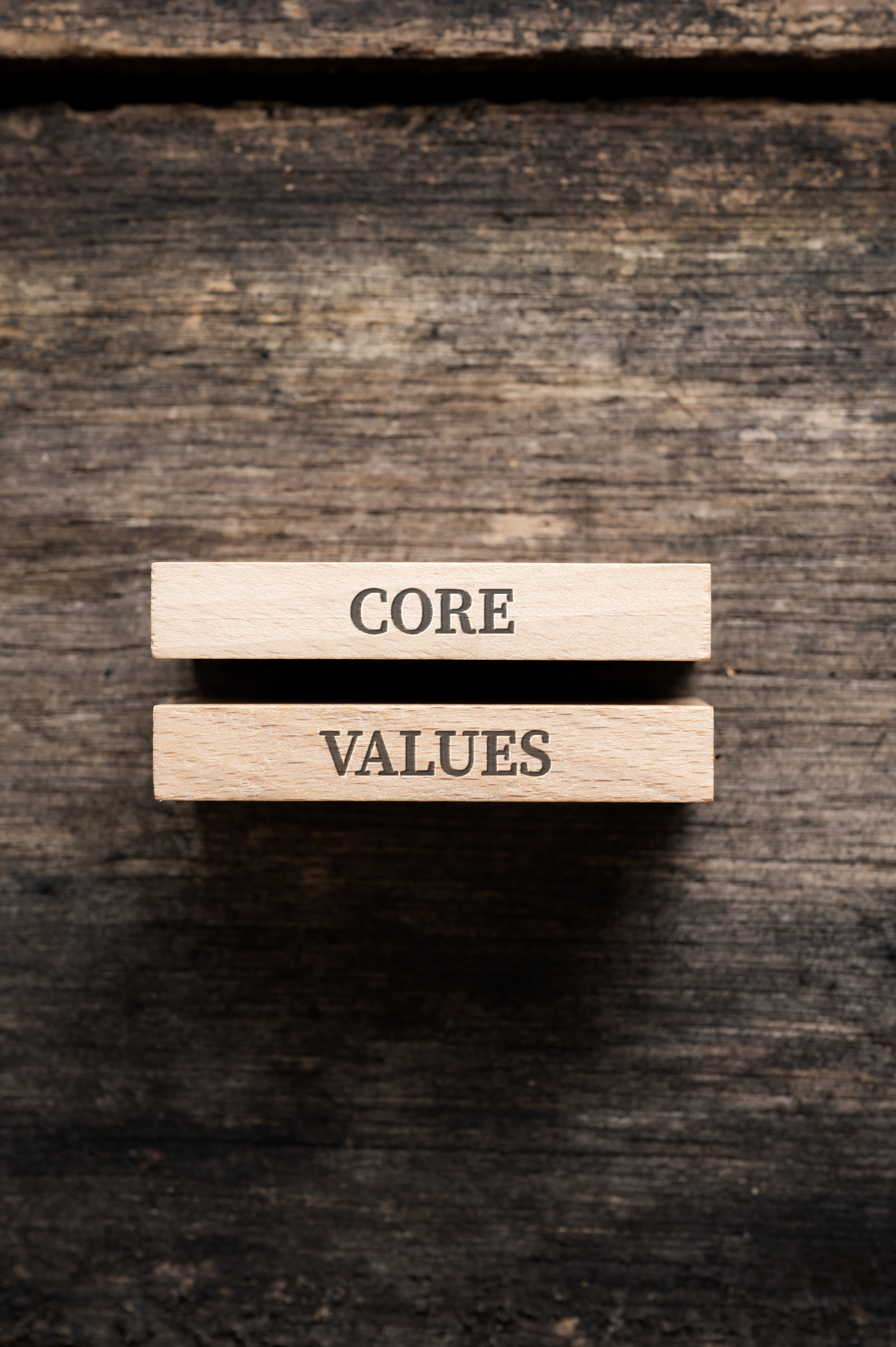 core values sign written on two stacked wooden pegs